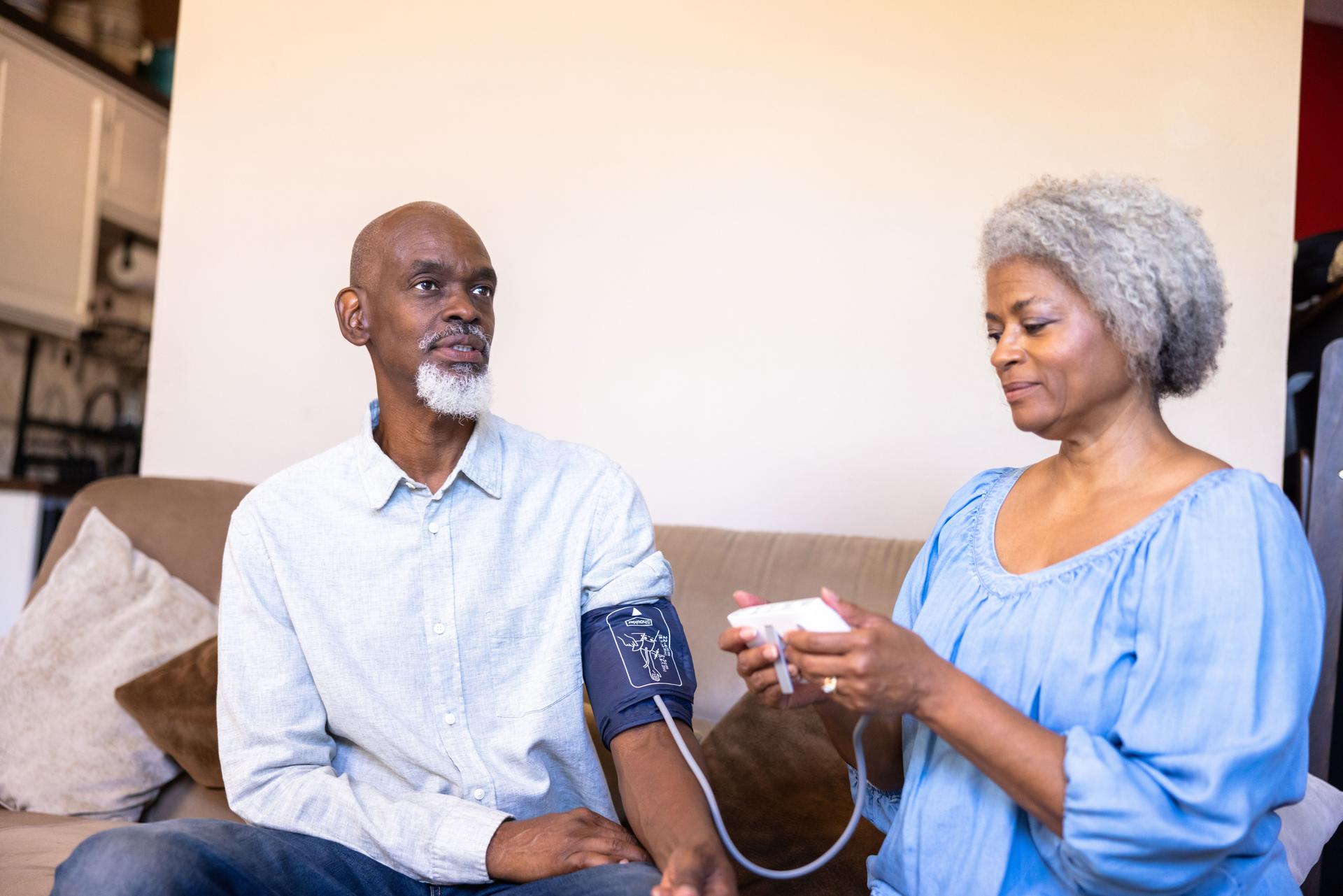 Senior black man blood pressure measurement
